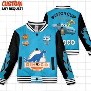 May include: A blue and black varsity jacket featuring a dinosaur logo and the text "DINOCO". The jacket has the number "95" and the text "PISTON CUP Champion Lightning Mc Queen" on the back. The sleeves are black with flame designs.