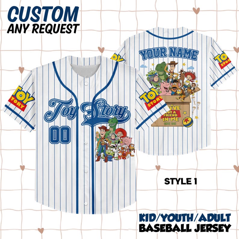May include: A white baseball jersey with blue pinstripes featuring Toy Story character graphics on the front and back. The front displays the Toy Story logo and the number 00. The back shows a box with characters and the text YOU'VE GOT A FRIEND IN ME.