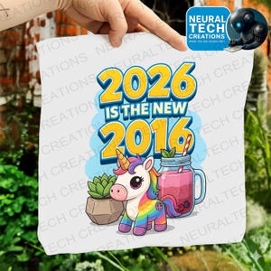 May include: A white square print with the text "2026 is the new 2016" in yellow and blue. The image also includes a cartoon unicorn with a rainbow mane and tail, a peace sign, and a pink drink in a mason jar.