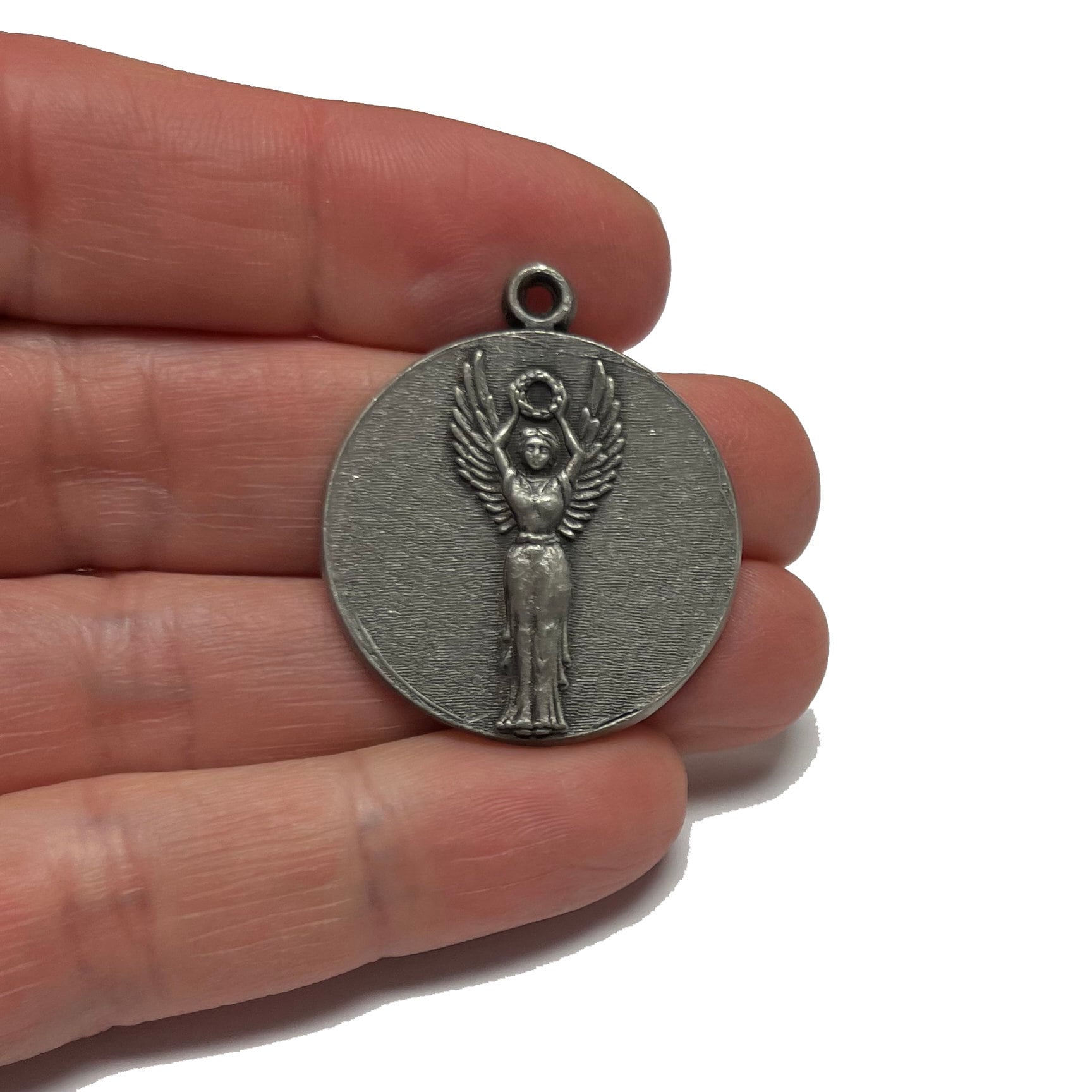 Goddess on olympic medals