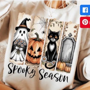 Puede incluir: Sudadera blanca con un gráfico de "Spooky Season". El diseño presenta un fantasma, una calabaza, un gato negro y una lápida. El fantasma lleva un sombrero de bruja y sostiene flores. El gato tiene el pecho blanco. También se incluyen calabazas y telarañas.