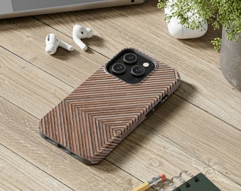 May include: A brown and beige phone case with a wood grain pattern and a chevron design. The case has a raised camera bump with three black camera lenses.