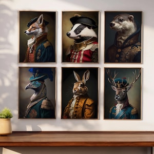 May include: Six framed prints of animals dressed in military uniforms. The animals include a fox, badger, otter, bird, rabbit, and deer. Each print has a gold frame and a white background.