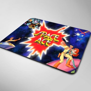 May include: A mousepad featuring a colorful illustration of characters from the Space Ace video game. The characters are standing in front of a red starburst with the words "Space Ace" in yellow letters.