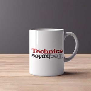 May include: White ceramic mug with a black and red "Technics SL-1210 MK2" logo printed on the front.