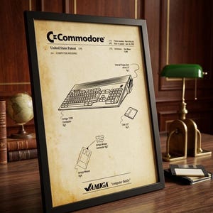 May include: Framed patent illustration of a Commodore Amiga 1200 computer, featuring a keyboard, mouse, and floppy disk. The patent is on aged paper with the Commodore logo and "United State Patent" text. The frame is black.