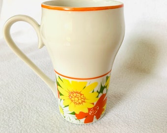 Fun Vintage Daisy Mug, bright colors! Orange, yellow, green. No maker or year listed.