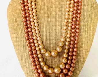 Vintage pink and cream colored necklace and clip on earrings set. Multip strand necklace with vintage closure.