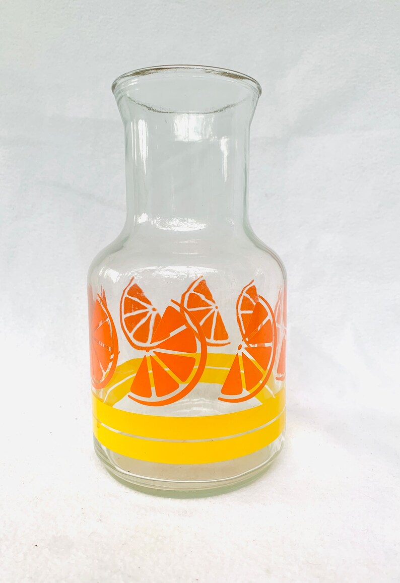 Vintage Orange Juice Container. Orange Slices and Yellow Striped Glass