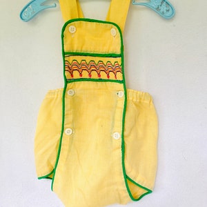 Adorable and Unique Vintage, Handmade baby play suit. Yellow Gingham with rainbow embroidery and Kelly green trim!