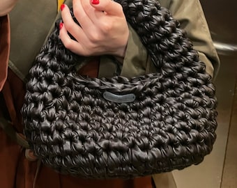 Stylish handmade bag in the trendy dark chocolate color with a short handle, made using a unique leather weaving technique