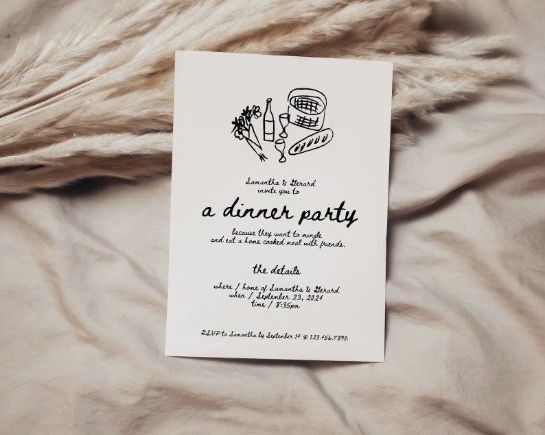 May include: A white invitation card with black text and a hand-drawn illustration of a picnic basket, wine bottles, glasses, and bread. The text reads "Samantha & Gerard invite you to a dinner party because they want to mingle and eat a home cooked meal with friends. The details: where/home of Samantha & Gerard when/September 23, 2024 time/8:35pm RSVP to Samantha by September 14 @ 123-456-7890"