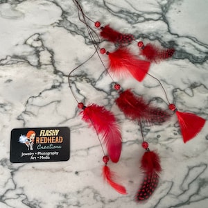 Feather Extension Hair Clip with red spotted feathers and sparkly beads