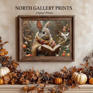 May include: A digital print of a brown rabbit wearing a colorful scarf and reading a book in a forest setting. The rabbit is surrounded by autumn leaves and a white butterfly.