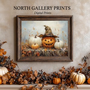 May include: A digital print of a painting featuring three pumpkins, one with a carved jack-o'-lantern face and a witch's hat. The pumpkins are surrounded by fall leaves and a blue sky.