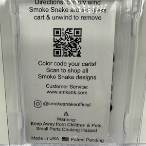 May include: A white card with black text and a QR code. The text reads: "Directions. Simply wind Smoke Snake around glass cart & unwind to remove. Color code your carts! Scan to shop all Smoke Snake designs. Customer Service: www.smksnk.com @smokesnakeofficial Warning: Keep Away from Children & Pets. Small Parts Choking Hazard. Made in USA Patent Pending."