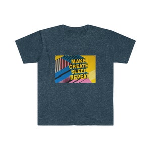 May include: A dark blue t-shirt with a yellow, pink, and blue graphic design. The graphic features the text "MAKE CREATE SLEEP REPEAT".