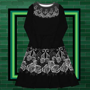 May include: A black long-sleeved dress with a white floral pattern. The dress has a fitted bodice and a flared skirt. The floral pattern is a repeating design of roses.