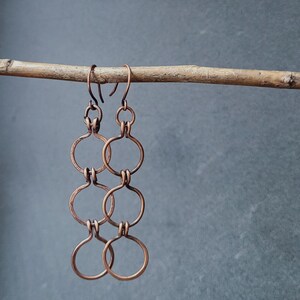 Handcrafted three copper wire hoops with beautiful patina.  Minimalist and unique.