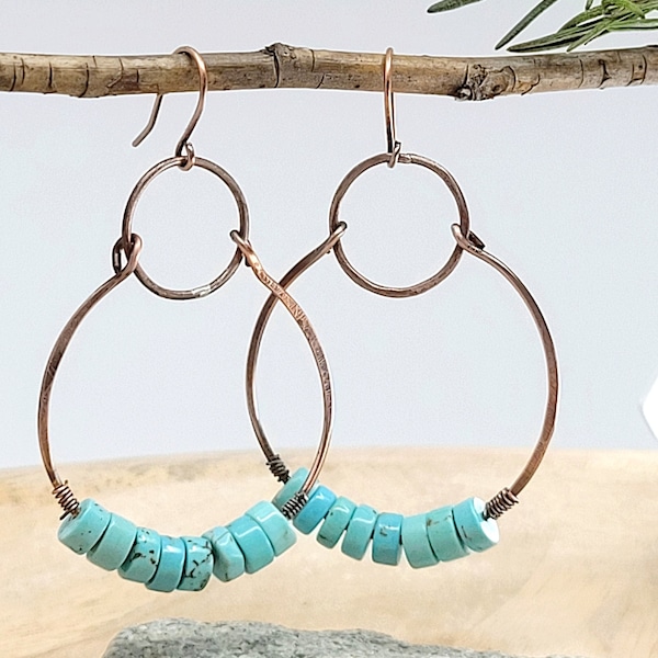 Handmade 2" copper hoops with light blue Jasper Heishi beads.  Beautiful patina brings out the deep, rich  copper. Perfect for Spring