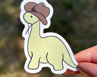 dinosaur wearing a cowboy hat sticker, cowboy sticker, dinosaur sticker, cute sticker, funny sticker, adorable, kawaii sticker, waterproof