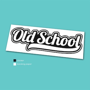 May include: A white sticker featuring the words "Old School" in a black, stylized font with a white outline. The sticker has a curved underline and is on a white backing paper.