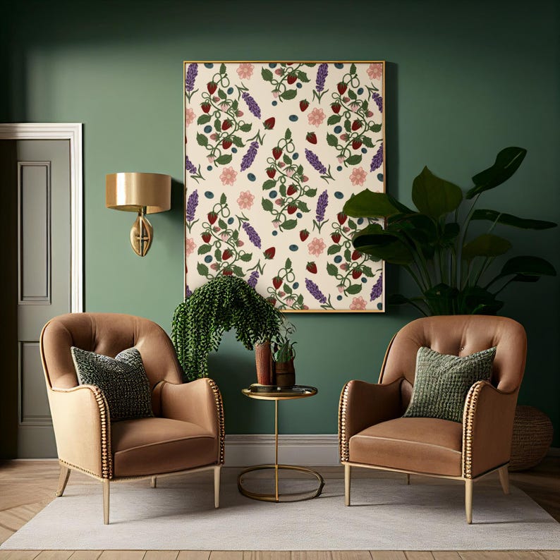 May include: A living room scene with two brown armchairs, each with a green pillow. A framed artwork with a botanical pattern of berries and flowers hangs above. A small gold side table and a wall-mounted gold lamp complete the decor.