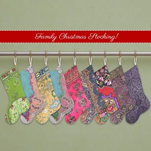 May include: A collection of nine colorful Christmas stockings hanging from a metal rod. Each stocking features a unique patterned fabric in shades of green, blue, pink, and purple. The text "Family Christmas Stocking!" is displayed on a red banner above.