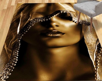 May include: A woman's face is partially obscured by a sheer, gold fabric with a beaded trim. The fabric drapes over her head and shoulders, creating a dramatic and mysterious effect.