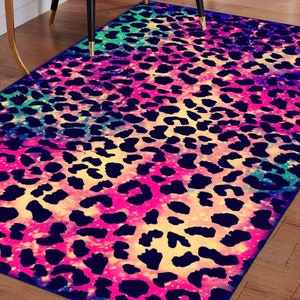 May include: A colorful rug with a leopard print pattern. The background is a pink, blue, and green gradient with a glittery effect.