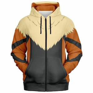 May include: A full-zip hoodie with a design featuring orange, black, and cream colors. The hoodie has a hood and two front pockets. The design resembles a stylized animal with a cream-colored chest and orange sleeves with black stripes.