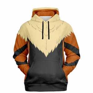May include: A black, orange, and cream colored hoodie with a graphic print of a Pokemon character. The hoodie has a drawstring hood and a kangaroo pocket.