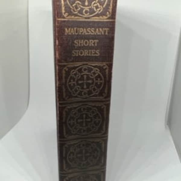 Copia antigua de The Complete Short Stories of Guy de Maupassant, publicada por Collier en 1903