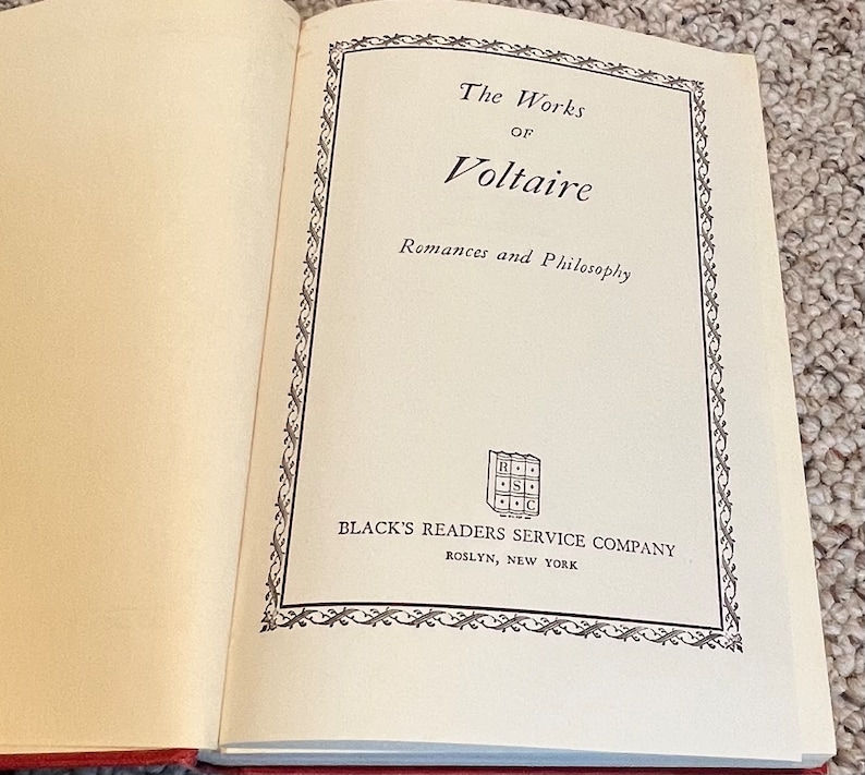 May include: The Works of Voltaire, Romances and Philosophy, book cover with a decorative border and the publisher's logo, Black's Readers Service Company, Roslyn, New York.