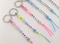 Personalized Smiley Face Name Keychain: Colorful Beaded Bag Charm. 100th days of school gift product logo