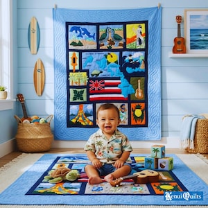 May include: A smiling baby sits on a blue quilt with Hawaiian-themed squares, including a map, flag, and pineapple. A matching quilt hangs on the wall. The baby wears a Hawaiian shirt and is surrounded by toys, including a ukulele and blocks.