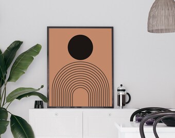 May include: A minimalist art print featuring a black circle and a series of concentric brown arches on a peach background.