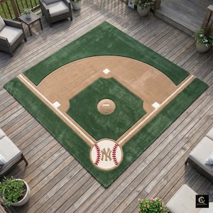 May include: A baseball field-design rug with a green outfield, tan infield, and white base lines. The rug features a baseball with the New York Yankees logo at the bottom. This rug is ideal for a sports fan's home.