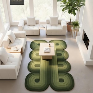 May include: A modern living room featuring a green, geometric area rug. The rug has a layered, curved design in shades of green. White sofas and a light wood coffee table complete the contemporary aesthetic. The text "ANYWAY CARPET" is visible.