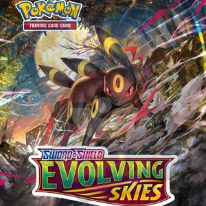 May include: A Pokémon Trading Card Game box featuring Umbreon, a dark-colored Pokémon with yellow accents and red eyes, set against a forest and moon backdrop. The box prominently displays the "Sword & Shield Evolving Skies" logo.