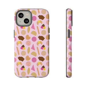 May include: A pink phone case with a pattern of various Mexican pastries, including conchas, pan dulce, and churros.