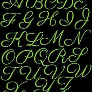 May include: A green cursive alphabet with all the letters from A to Z.