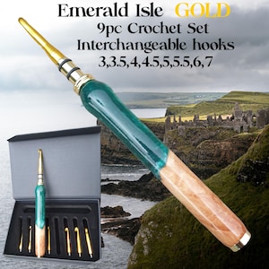 May include: Emerald Isle GOLD 9pc Crochet Set Interchangeable hooks 3, 3.5, 4, 4.5, 5, 5.5, 6, 7. A crochet hook with a gold-coloured metal tip and a handle featuring a green resin top and a light brown wood bottom, presented in a grey storage box.