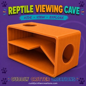 May include: An orange rectangular reptile viewing cave with a multi-level interior, a circular side entrance, and a circular top opening. The text REPTILE VIEWING CAVE, HIDE VIEW EXPLORE, and CUDDLY CRITTER CREATIONS cuddlycrittercreations.com are visible.