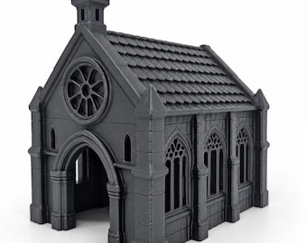 May include: A matte black miniature church building featuring a pointed roof with textured shingles, a circular rose window above an arched entryway, and multiple tall, narrow arched windows along the side walls with detailed buttresses.