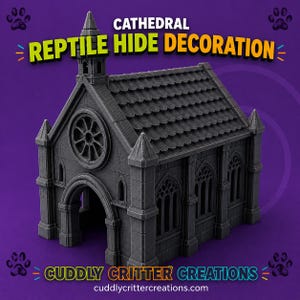 May include: A dark grey cathedral reptile hide decoration featuring a roof with shingle details, a rose window, and arched doorways. The text CATHEDRAL REPTILE HIDE DECORATION and CUDDLY CRITTER CREATIONS with the website address are printed on the purple background.