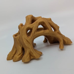 May include: A brown, stylized tree stump with multiple openings and a textured surface. The decorative piece has a natural wood grain appearance and is designed to resemble a small archway or tunnel. It is likely a decorative item for a terrarium or aquarium.