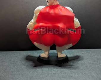 May include: A figurine of a superhero character, viewed from the back. The figure has a red cape, white arms and legs, and a muscular build. The character has a black mustache and hair. The figurine is on a black base.