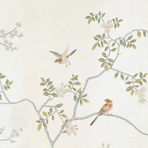 May include: A white background with a delicate floral pattern featuring green leaves and white flowers. Two birds are perched on the branches, one in flight and the other resting.