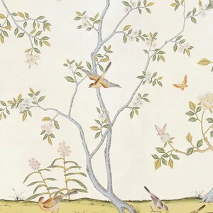 May include: A white background with a delicate floral pattern featuring a light blue tree with pink flowers and green leaves.  There are several small brown and yellow birds perched on the branches and flying around the tree.  There are also a few butterflies in the image.